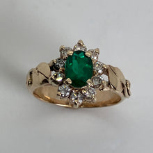 Load image into Gallery viewer, brillian emerald in a halo of diamonds and leaves in 14K yg