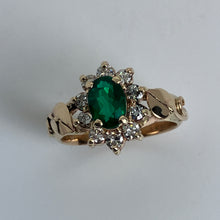 Load image into Gallery viewer, perfect color emerald in a halo of diamonds with precious leaves on the side ring