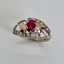 Load image into Gallery viewer, deep red ruby surrounded by diamonds and leaves in an openwork ring