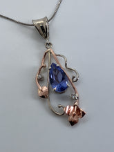 Load image into Gallery viewer, airy large pears-haped tanzanite surrounded by 14K rose & white gold flower & vines