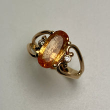 Load image into Gallery viewer, Large orange gemstone and 2 smaller diamonds in a 14K yellow gold open heart setting