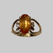 Load image into Gallery viewer, Large sparkling orange Imperial Topaz and 2 smaller diamon in a 14K yellow gold open heart band.