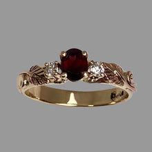 Load image into Gallery viewer, Gold ring with a deep red garnet and diamonds with leaves and vines