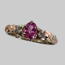 Load image into Gallery viewer, 14K white and rose gold ring has an oval pink sapphire and 2 smaller upcycled diamonds, embellished with artist's leaves and vines