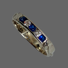 Load image into Gallery viewer, 3 bright blue sapphires and 2 upcycled diamonds channel set in white 14K gold band with 2 leaves and vines