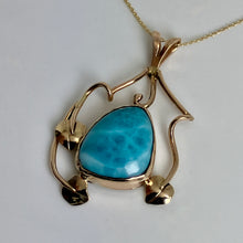 Load image into Gallery viewer, 14K Gold pendant on a bail with a bezel set mottled ocean blue stone that has 3 leaves and vines around it.