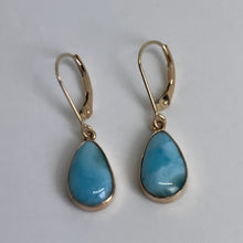 Load image into Gallery viewer, 14 yellow gold earrings with sky blue teardrop stones in bezel settings on European ear wires.