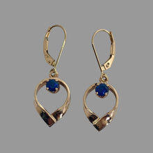 Load image into Gallery viewer, 14K yellow gold earrings with round prong set blue sapphires, in the top center of teardrop shaped open goldwork, on eurowires.