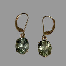 Load image into Gallery viewer, Facetted green oval gem stones, prong set in 14K yellow gold and eurowires.