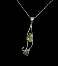 Load image into Gallery viewer, Bright green teardrop shape peridot set in a gold calla lily design, on a square cable chain,  lobster claw clasp.
