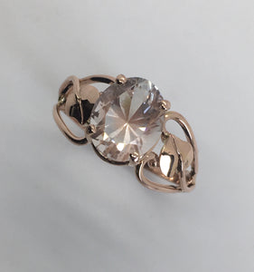 delicate pink oval topaz in rose gold setting with leaves