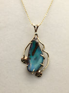 playful blue/green boulder opal pendant with red play of fire