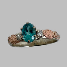 Load image into Gallery viewer, oval teal tourmaline flanked by 2 recycled diamonds and rose gold leaves
