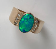oval extra fine opal ring with lots of green flash