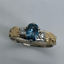 Load image into Gallery viewer, 14K white gold and 18K yellow gold band with leaves, diamonds and a gorgeous ocean colored Montana Sapphire
