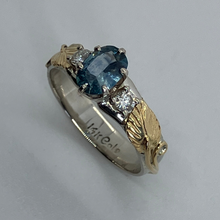 Load image into Gallery viewer, ocean colored oval Montana Sapphire with2 recycled diamonds in a mixed gold band
