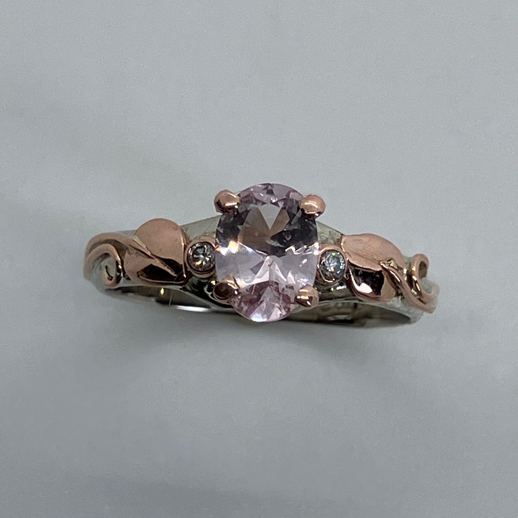 gentle pink morganite with rose gold prongs in a white  gold band and rose gold leaves and recycled diamonds