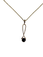intense deep purple Amethyst in simple 14K gold pendant