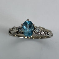 14K white gold ring with oval faceted aquamarine, 2 diamonds, leaves and vines