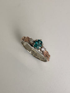 gorgeous green gem with 2 diamonds in a 14K rose and white gold band