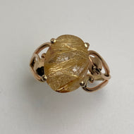 pretty oval quartz gem,with lots of thin rutile crystals in 14K yellow gold ring