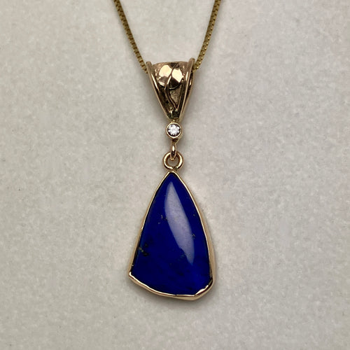 blue lapis pendant, small diamond and a handmade leaf on the bale, 14K gold box chain