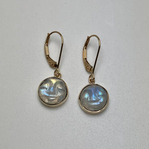 Pair of gold earrings with round carved moonstones 