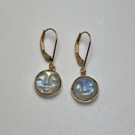 Pair of gold earrings with round carved moonstones 