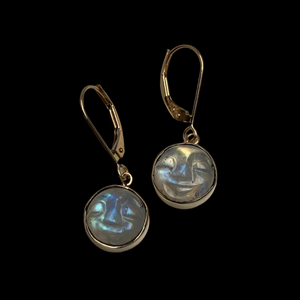 Pair of carved moonstone face earrings in 14K yellow gold