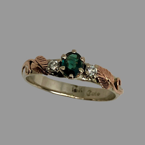 blue/green garnet ring with 2 diamonds in white gold with  rose gold accents 