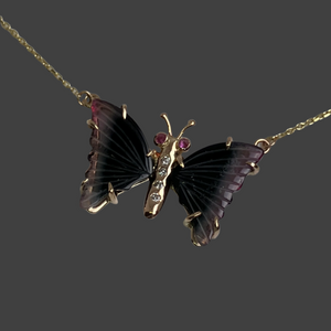 dark green watermelon tourmaline wing butterfly necklace with pink sapphire eyes and diamonds on the body