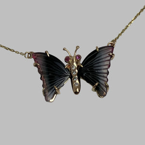 Butterfly-shaped necklace with tourmaline wings, pink sapphire eyes and a diamond  studded body 