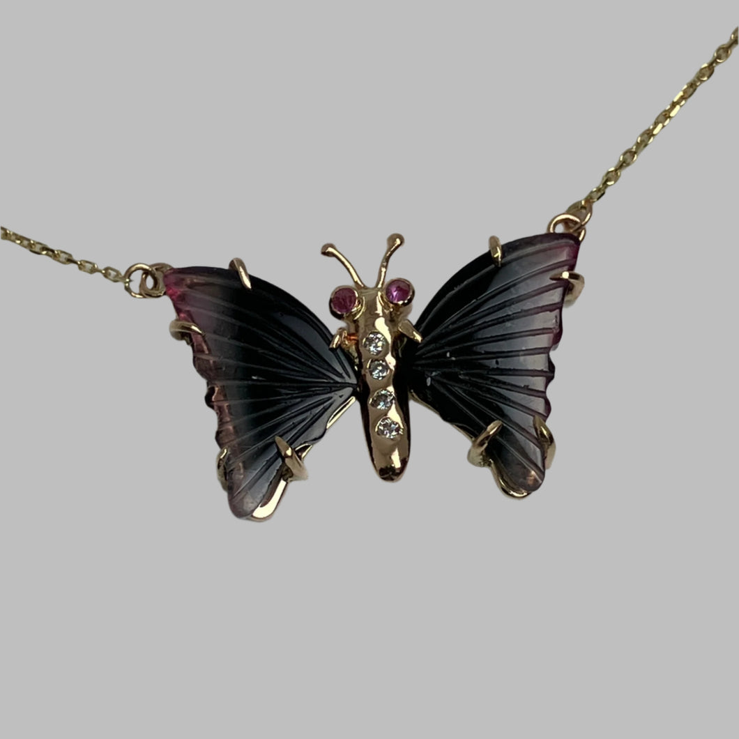 Butterfly-shaped necklace with tourmaline wings, pink sapphire eyes and a diamond  studded body 