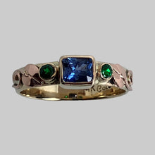 Load image into Gallery viewer, 14K yellow band with rose gold leaves and swirls, blue emerald cut saphhire and round tsavorite garnets
