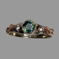 white and rose 14K gold ring with round  teal sapphire, 2 diamonds and 2 leaves and vines