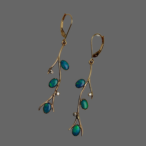 14k Gold earrings with 3 oval natural oplals and 2 diamomds each