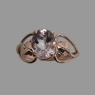 Oval faceted pink Morganite  gem in a 14K Rose gold ring with handmade leaves in setting with open hearts on the sides
