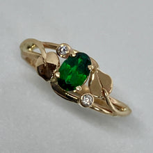 Load image into Gallery viewer, oval natural green garnet with 2 small round diamonds and 2 leaves and vines in a 14 yellow gold ring
