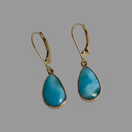 14K gold earrings with  pear shaped marbled turquoise color stones set in handmade bezels