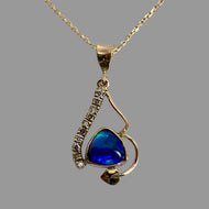 14K yellow gold necklace featuring a bezel set triangle blue/green/purple crystal opal, 10 small upcycled diamonds, swerving vine with an ivy leaf