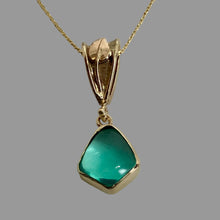 Load image into Gallery viewer, A 14K yellow gold pendant necklace featuring an organic-shaped green Peruvian Opal on a handmade 14K gold bail adorned with a leaf and vine.
