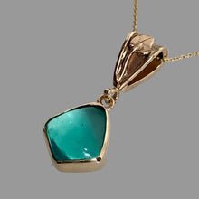 Load image into Gallery viewer, 14K yellow gold pendant with freeform green Peruvian Opal in a bezel setting, suspended from a fancy bail with a leaf and vine motif, on an 18" square cable chain.
