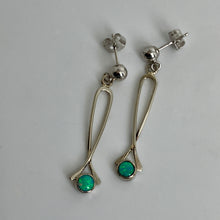 Load image into Gallery viewer, 14K white gold dangle earrings with bezel set green/blue opals and  white gold crossing above the opals.
