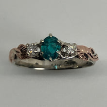 Load image into Gallery viewer, 14K white gold band set with an oval ultra rare prong set Grandidierite gem, 2 round diamonds and a pair of 14K rose gold leaves and vines.
