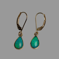 A pair of 14K gold leverback drop earrings with teardrop-shaped green/blue opal gemstones.