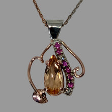 Load image into Gallery viewer, 14K rose gold pendant with a central Imperial Topaz, 6 pink sapphires and 2 diamonds with leaf and vine
