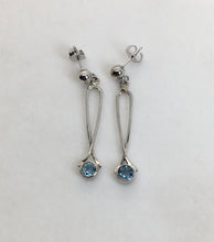 Load image into Gallery viewer, Sparkling round Aquamarine earrings bezel set in loops of white gold
