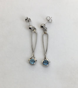 Sparkling round Aquamarine earrings bezel set in loops of white gold