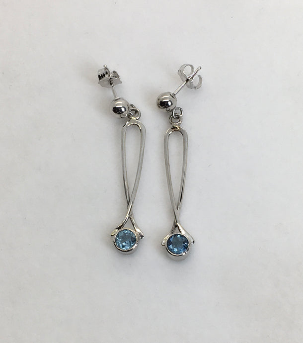 Sparkling round Aquamarine earrings bezel set in loops of white gold