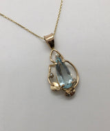 long pear shape Aquamarine 2 leaves near bottom